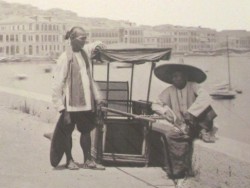 A sedan chair with two bearers